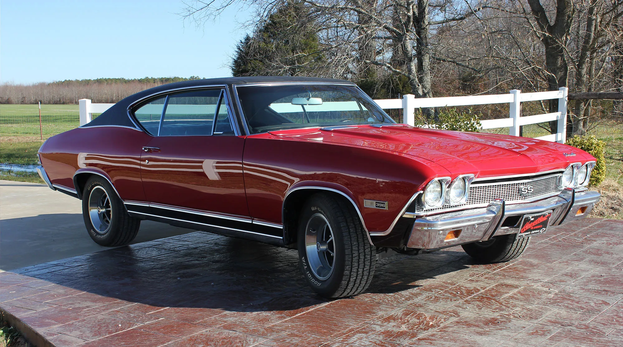 A candy-red Chevelle SS 396, built with a custom stance