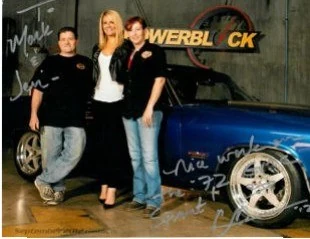 A signed PowerBlock TV set photo with the family and a custom blue build